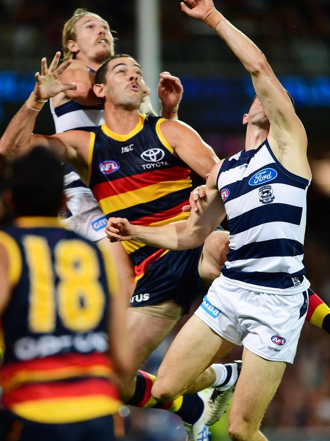 Crows captain Taylor Walker battles against two Geelong defenders on Thursday. Picture: Mark Brake/Getty Images