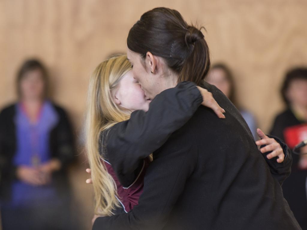 New Zealand Prime Minister Jacinda Ardern hugs a student at Cashmere High School. Picture: David Alexander/AAP