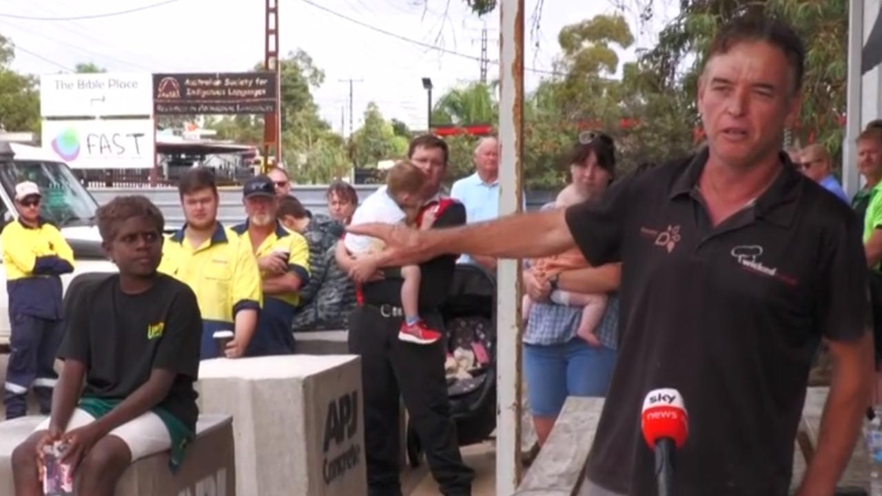 Grab of Darren Clark being interviewed on sky with an Indigenous boy in Alice Springs. Sky