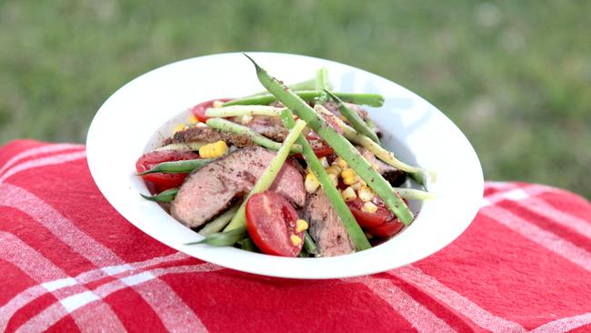 BBQ prime rib of beef with baby bean, corn and sweet pepper salad recipe by Lyndey Milan.