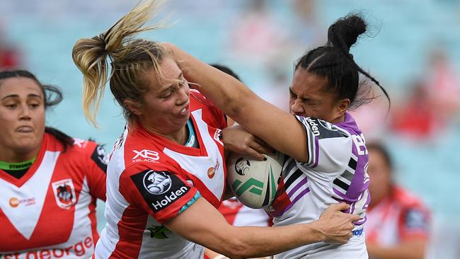 Langi Veainu of the Warriors is tackled by Kezie Apps of the Dragons during the NRL Women's Premiership match between the St George-Illawarra Dragons and the Warriors at ANZ Stadium in Sydney, Saturday, September 15, 2018. (AAP Image/Dan Himbrechts) NO ARCHIVING, EDITORIAL USE ONLY