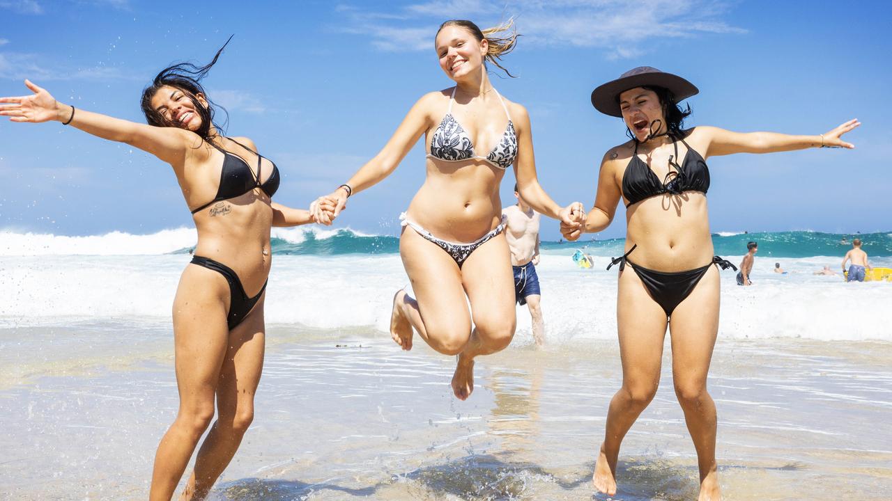 Maria Fernanda Rozo &amp; Maria Jose Delgado from Columbia laughing in sun on Bronte Beach, Sydney. They were among the thousands who flocked to the beach. Picture: Ted Lamb