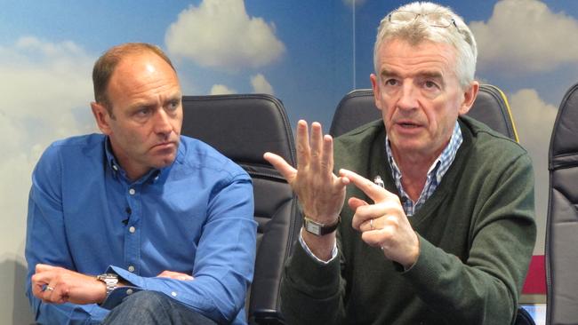 A Tuesday, April 24, 2016 photo of Ryanair Chief Executive, Michael O'Leary, right, at the airline's Dublin headquarters addressing media alongside Ryanair marketing director, Kenny Jacobs. European budget carrier Ryanair has posted record full-year profits and passenger figures, Monday, May 23, 2016, and expects both to hit new highs this summer amid rapid growth and declining fares. (AP Photo/Shawn Pogatchnik)