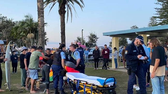 Paramedics treating Mr Hoffman after he was bitten by a shark at Crescent Head Picture: Facebook https://www.facebook.com/TheCrescentHeadSantaSurf