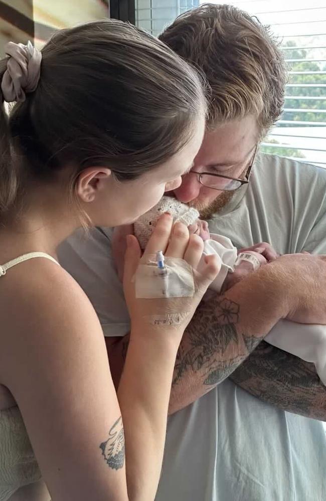 Kieran and Alexis Ford holding their baby in hospital. Picture: Supplied