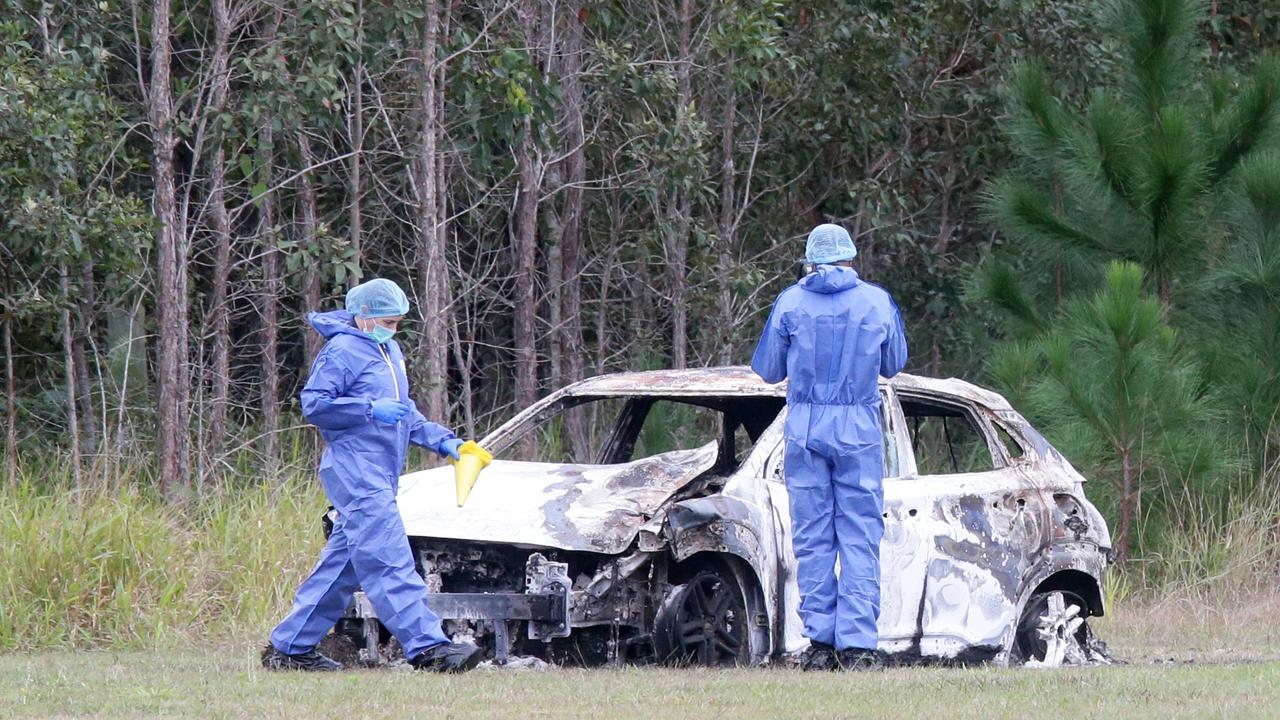 Police at the scene with the allegedly stolen car, found burned out in Moodlu, north of the crash.