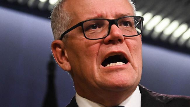 Australia's former prime minister Scott Morrison speaks to media during a press conference in Sydney on August 17, 2022. - Australia's Prime Minister Anthony Albanese on August 16 said that his predecessor Scott Morrison secretly seized control of five ministerial posts, labelling it an "unprecedented trashing of our democracy". (Photo by Steven Saphore / AFP)