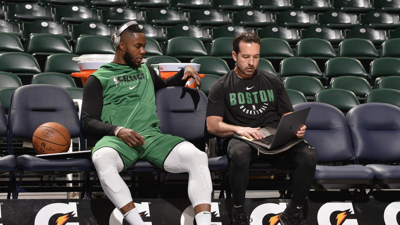 Boston’s Semi Ojeleye watches film with assistant coach Scott Morrison in 2019. Picture: David Dow/NBAE via Getty Images