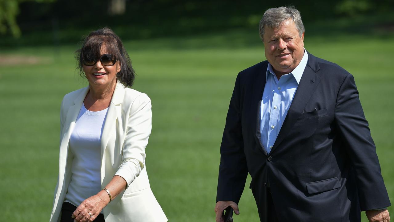 On June 18, 2017 Viktor and Amalija Knavs, the parents of then US First Lady Melania Trump, walk to the White House in Washington, DC. (Photo by MANDREL NGAN / AFP)