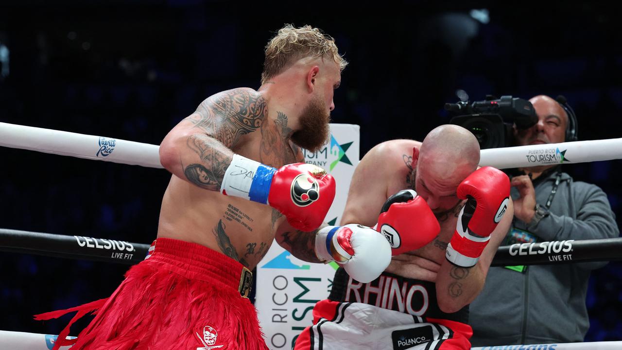 Bourland covers up before the fight is ended. Al Bello/Getty Images/AFP.