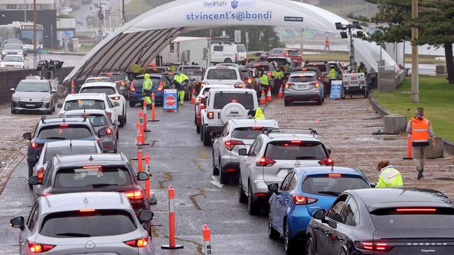 Cars queue at the Bondi Beach COVID-19 drive-through testing centre on Thursday. Picture: Damian Shaw