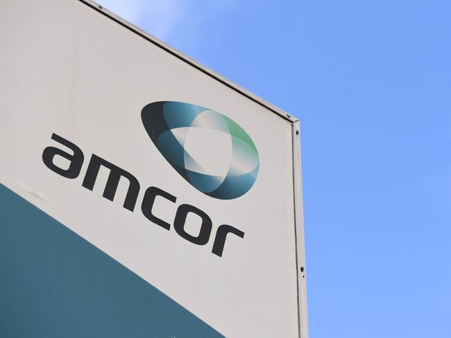 A sign of Australian packaging group Amcor is seen outside one of its packaging facilities in Melbourne on August 7, 2018. Australian firm Amcor announced a 6.8 billion USD buyout of US rival Bemis on August 7 to become the world's largest plastic packaging group, and will shift its primary listing to the New York Stock Exchange. / AFP PHOTO / William WEST