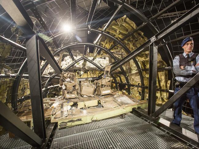 Inside the reconstructed plane ... what was left after the Buk missile struck. Picture: Ella Pellegrini