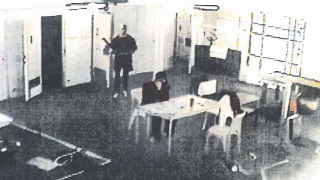 CCTV shows Johnson stalking Carl Williams in Barwon Prison.