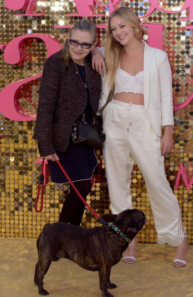 Carrie Fisher with her daughter Billie Lourd and beloved pooch Gary at the world premiere of Absolutely Fabulous - The Movie in London. Picture: Tony Clark/Splash News