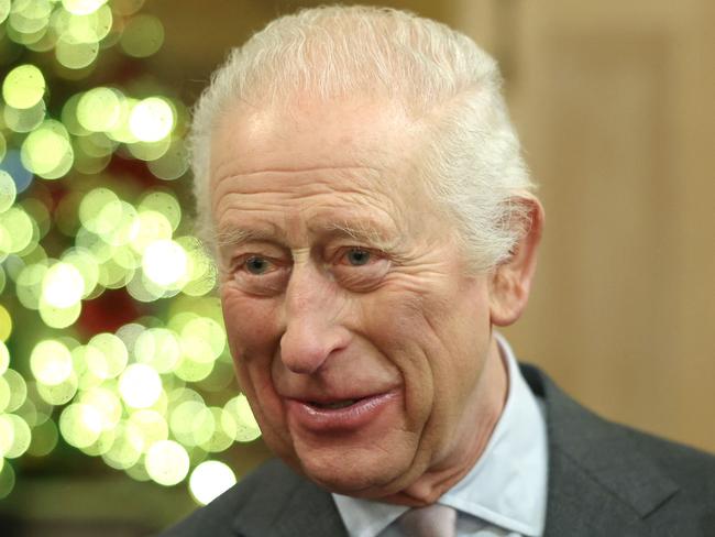 Britain's King Charles III smiles during The King's Foundation's annual 'Crafts at Christmas' at Highgrove Gardens on December 13, 2024 in Tetbury, western England. The King's Foundation is a charitable organisation established by His Majesty when he was Prince of Wales, in 1990. The foundation's mission is to foster and strengthen communities where people, places, and the planet can thrive together in harmony. King Charles III continues to serve as the foundation's Royal Founding President. (Photo by Chris Jackson / POOL / AFP)