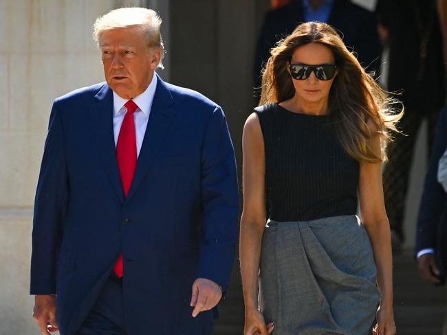 (FILES) Former US President Donald Trump and his wife,  Melania Trump, leave a polling station after voting in the US midterm elections in Palm Beach, Florida, on November 8, 2022. Trump gave himself up to US Marshals in Miami on June 13 to be arraigned on a slew of federal charges over his alleged mishandling of government secrets since leaving the White House. But his wife was nowhere to be seen, raising eyebrows among Trump-watchers by declining to accompany him to the courthouse or even release a supportive statement from a distance. (Photo by Eva Marie UZCATEGUI / AFP)