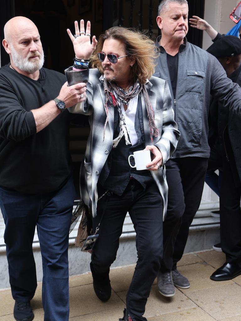 Johnny Depp walked out of Grand Hotel Birmingham England by security ...