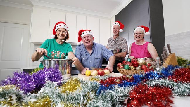 The Cairns community Christmas charity lunch, a completely free lunch held on Christmas day every year, is looking for volunteers. Volunteer Catherine Louison, event organiser David Lennie and volunteers Ron Baldwin and Ursula Baldwin are looking for more people willing to help for a few hours on Christmas Day, when the lunch will be served at St Augustine's College. Picture: Brendan Radke