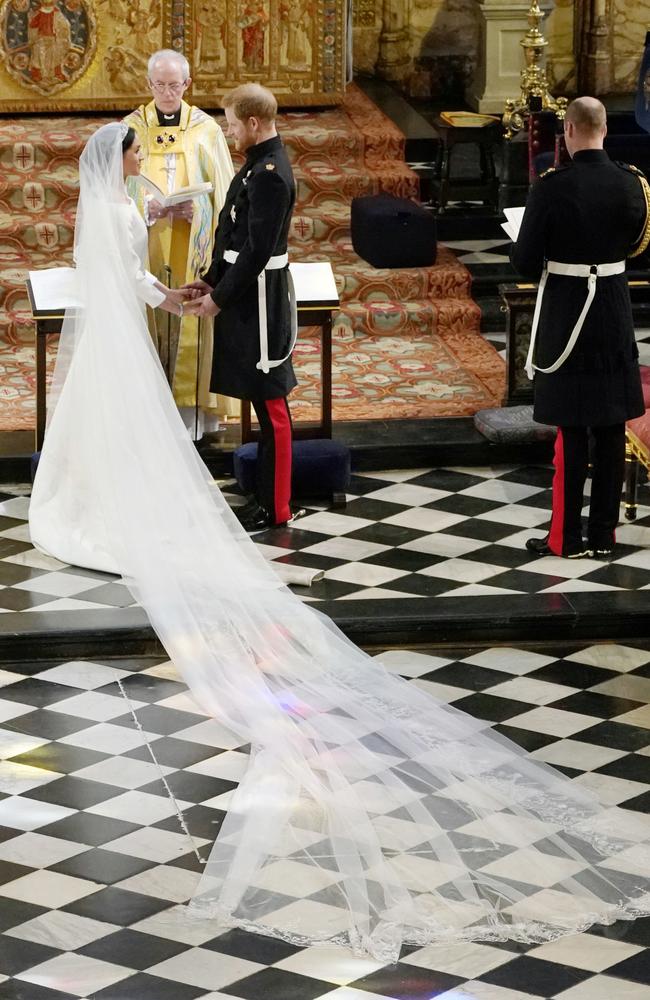 Britain's Prince Harry and Meghan Markle exchange vows during their wedding ceremony at St. George's Chapel in Windsor Castle in Windsor, near London, England, Saturday, May 19, 2018. Picture: Owen Humphreys/AP