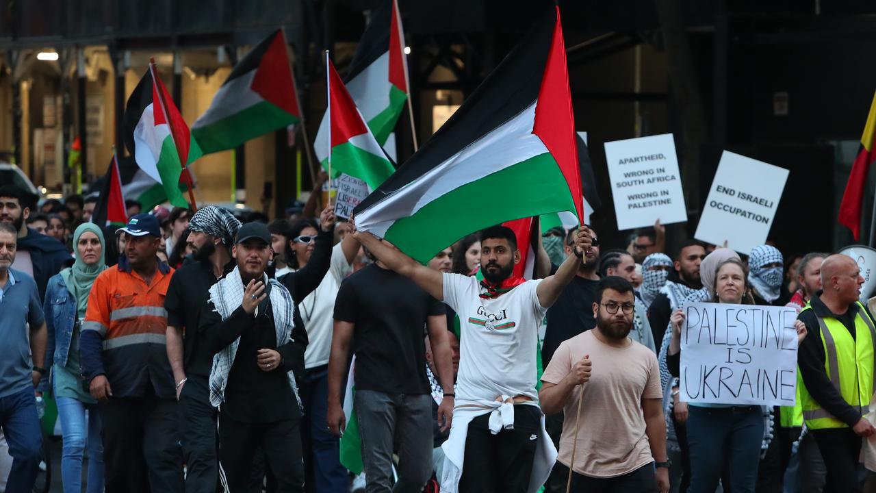 Palestinian supporters march towards the Sydney Opera House during a rally on Monday. Photo: Lisa Maree Williams.