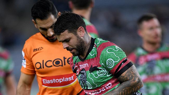 Adam Reynolds of the Rabbitohs receives attention from a trainer during the Round 11 NRL match between the South Sydney Rabbitohs and the Wests Tigers at ANZ Stadium in Sydney, Saturday, May 25, 2019. (AAP Image/Dan Himbrechts) NO ARCHIVING, EDITORIAL USE ONLY