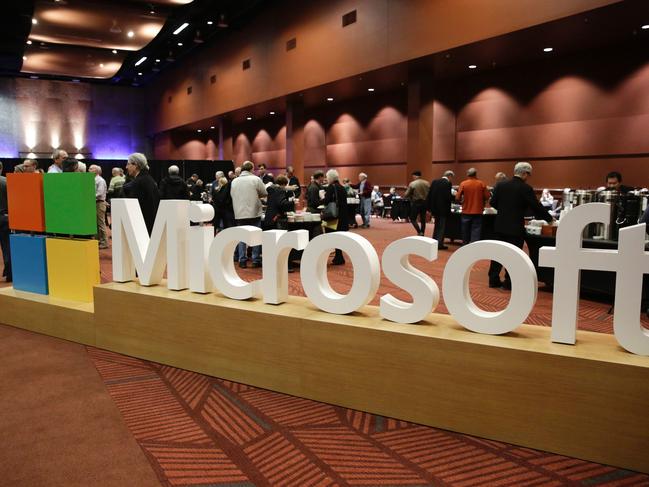 (FILES) This file photo taken on November 30, 2016 shows the Microsoft logo at the Microsoft Annual Shareholders Meeting in Bellevue, Washington. Microsoft said on July 6, 2017 it was cutting an unspecified number of jobs amid reports the US tech giant was reorganizing its global sales operations."Today, we are taking steps to notify some employees that their jobs are under consideration or that their positions will be eliminated," Microsoft said in an email response to an AFP inquiry.  / AFP PHOTO / GETTY IMAGES NORTH AMERICA / Jason Redmond