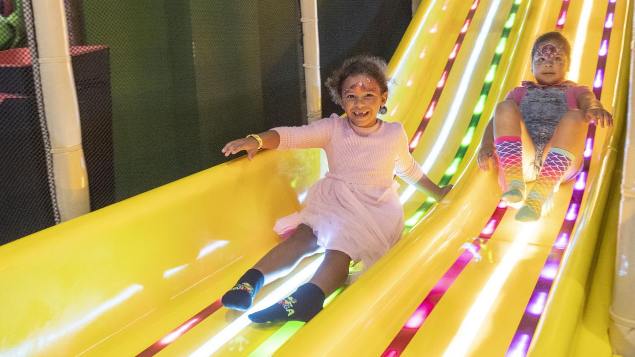 Ardia Ghilotti and Lulu Harris try the slide. Tabatinga at City Golf Club. Saturday, March 11, 2023. Picture: Nev Madsen.