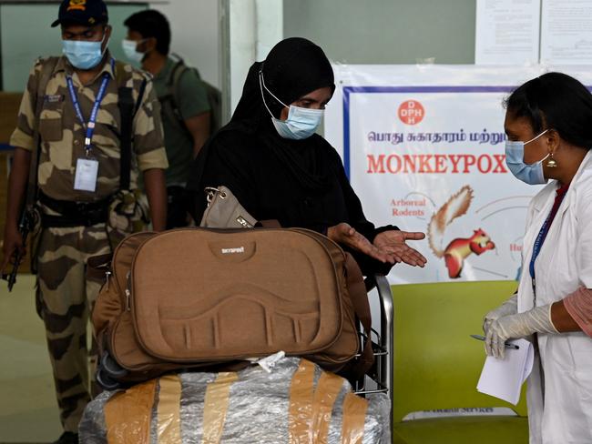 Health workers screen passengers arriving from abroad for Monkeypox symptoms at Anna International Airport terminal in Chennai. Picture: AFP