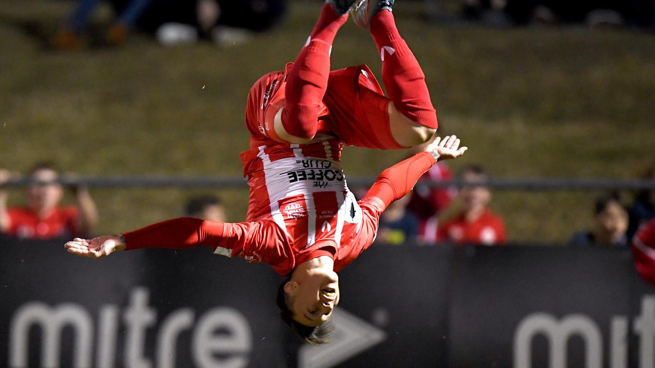 Chris Lucas of Brisbane’s Olympic FC celebrates a goal in style. (Photo by Bradley Kanaris/Getty Images)