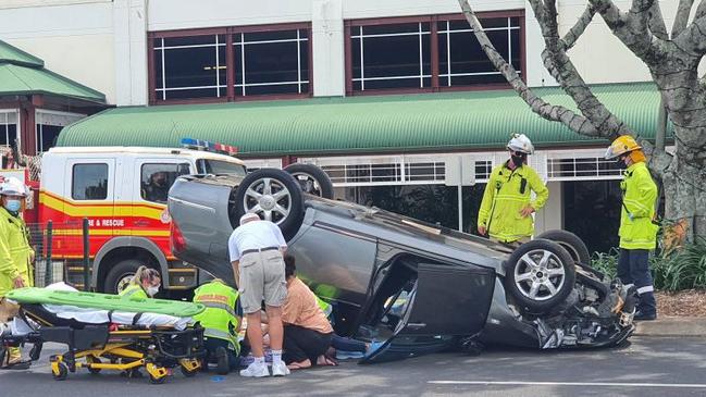 A car has flipped upside after a single vehicle crash on Bunda Street in Cairns City.