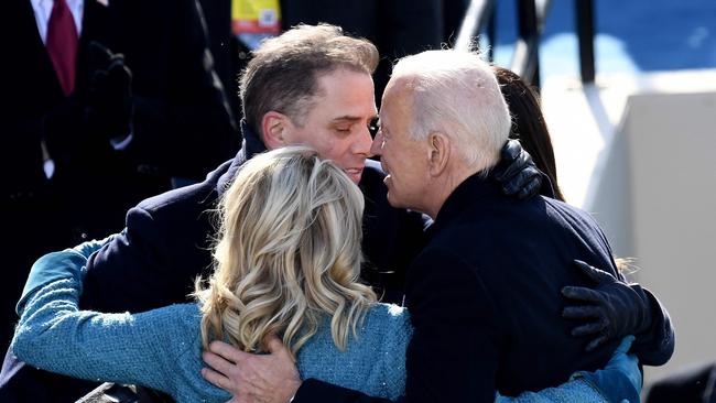 US President Joe Biden hugs his son Hunter Biden and US First Lady Jill Biden after being sworn in as the 46th US President.
