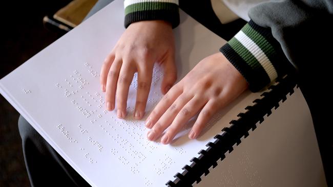 Kiara Risnes reads braille music. Picture: Jeremy Piper