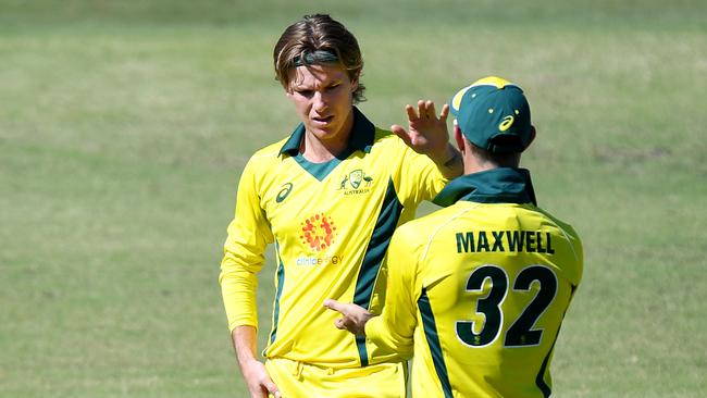 Adam Zampa is congratulated by teammate Glenn Maxwell during their World Cup warm-up match. Picture: Getty