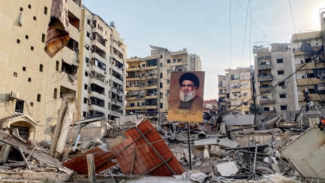 A portrait of slain Hezbollah leader Hassan Nasrallah sits amids debris in Beirut. Picture: AFP