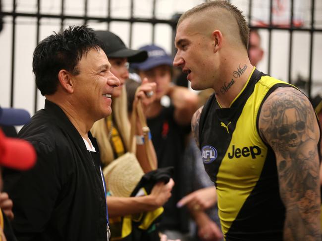 Ralph Carr chats with his client, Richmond's Dustin Martin, before a game earlier this year. Picture: Michael Klein