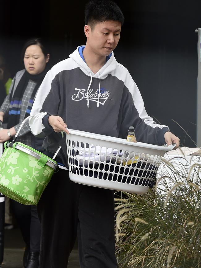 Owners and tenants were seen carrying their personal items out of the building over the weekend. Picture: Bianca De Marchi