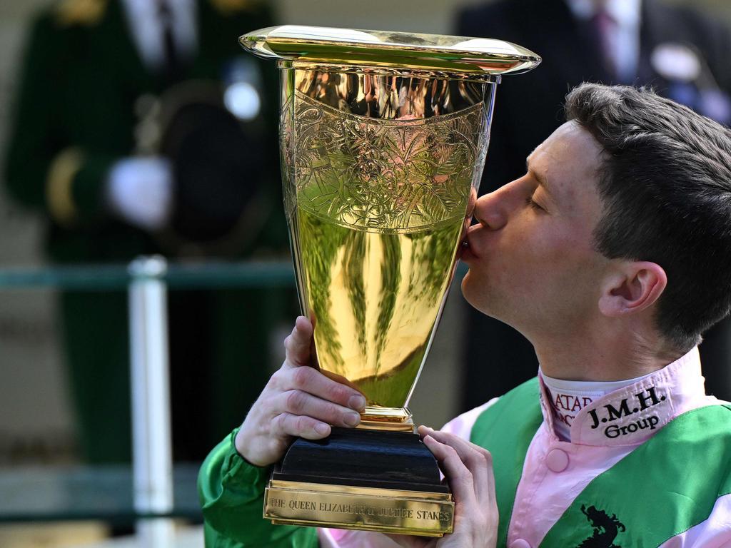 Jockey Oisin Murphy kisses the trophy after winning the Queen Elizabeth II Jubilee Stakes with Khaadem. Picture: AFP