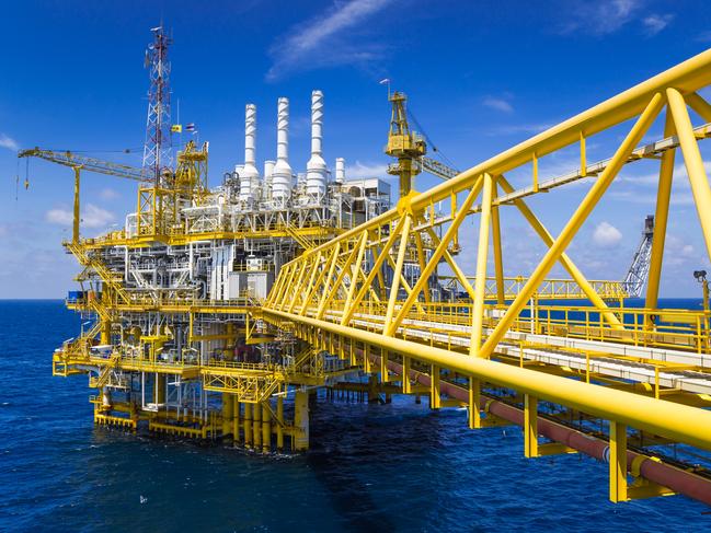 Oil and Gas production platform in blue sky located at the gulf of Thailand.