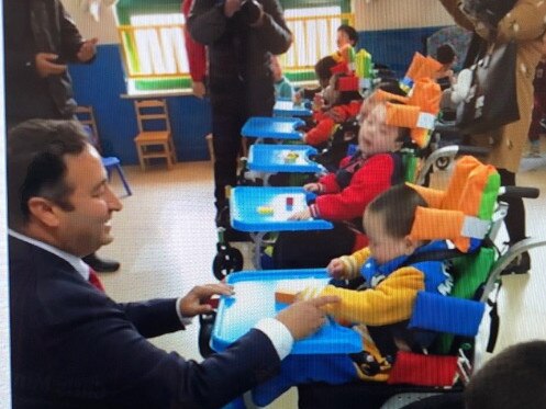 Labor MP Shoquett Moselmane visiting disabled children in a Chinese orphanage – after fundraising to help supply them with wheelchairs. Picture Supplied.