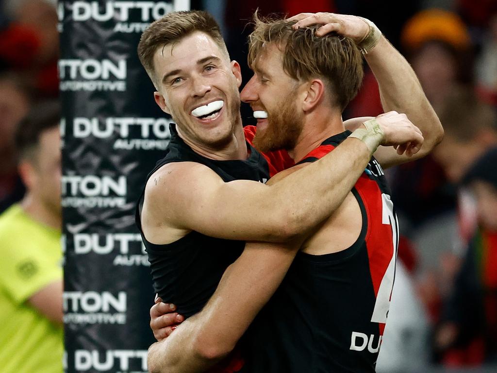 MELBOURNE, AUSTRALIA – JUNE 23: Zach Merrett (left) and Dyson Heppell of the Bombers celebrate during the 2024 AFL Round 15 match between the Essendon Bombers and the West Coast Eagles at Marvel Stadium on June 23, 2024 in Melbourne, Australia. (Photo by Michael Willson/AFL Photos via Getty Images)