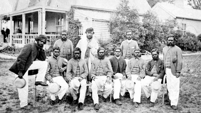 Tom Wills, standing centre, with an indigenous cricket team at the MCC pavilion on the new police paddock site in Richmond in 1866.