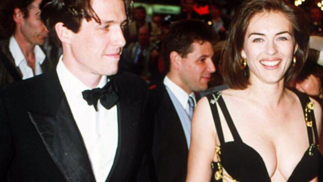 11/05/1994. File picture of actors Hugh Grant and Elizabeth Hurley supplied by (c) UPPA. Premiere of Four Weddings and a Funeral. Liz Hurley. Versace. Safety pin dress.