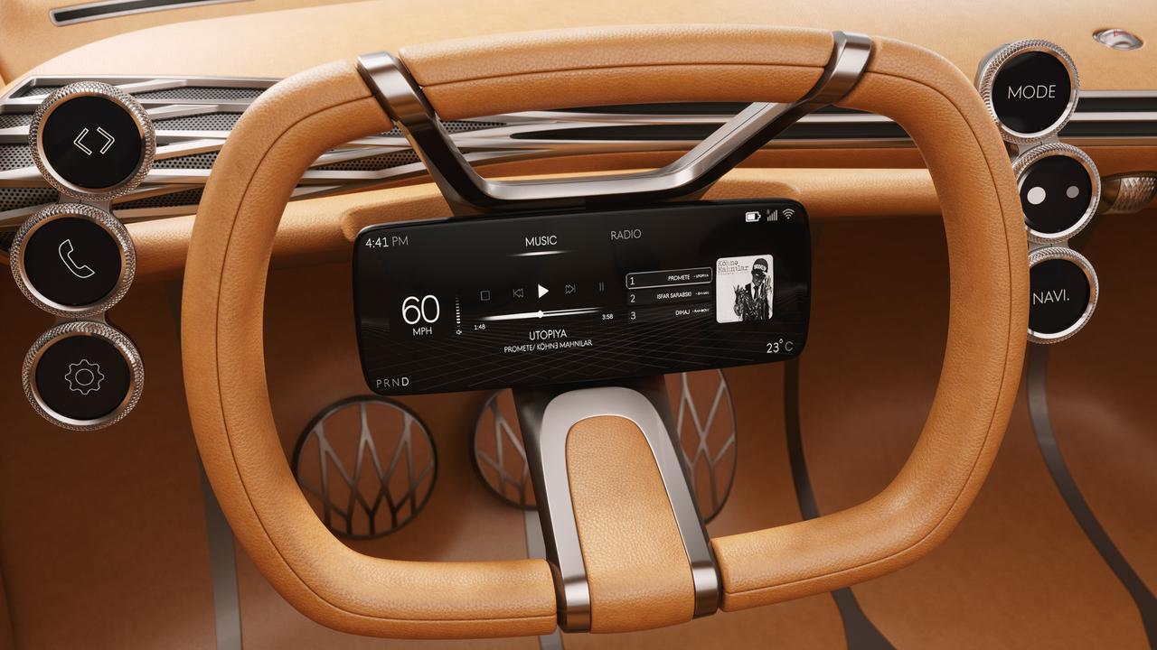 The instrument display is located in the centre of the steering wheel rather than behind.