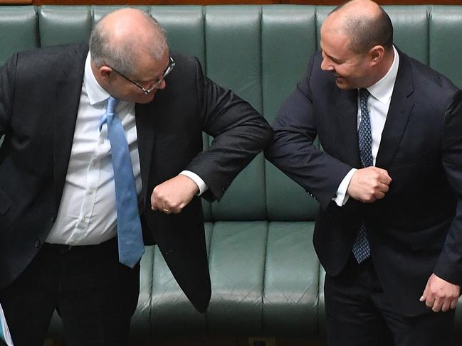 *** BESTPIX *** CANBERRA, AUSTRALIA - APRIL 08: Prime Minister Scott Morrison (L) react with Treasurer Josh Frydenberg after the Coronavirus Economic Response Bill was presented in the House of Representatives on April 08, 2020 in Canberra, Australia. The governments $130bn AUD Coronavirus Economic Response Bill will be put to parliament today with about 40 lower-house MPs expectedÂ­ attendÂ­ for the extraordinary COVID-19 sitting. After discussions between Prime Minister Scott Morrison and Opposition Leader Anthony AlbanesÂ­e a decision was made to recall parliament for the wage subsidy package to be considered by the limited number of MPs and senators. (Photo by Sam Mooy/Getty Images)