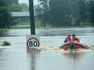 An SES boat patrols the flooded waterways of the Hawkesbury River at Vineyard on Thursday. Picture: Jeremy Piper