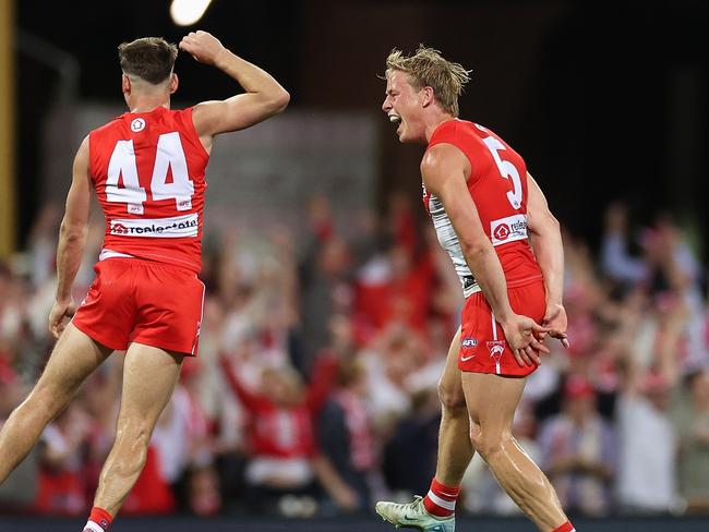 Isaac Heeney celebrates bringing the scores level during the last quarter. Picture: Cameron Spencer/Getty Images