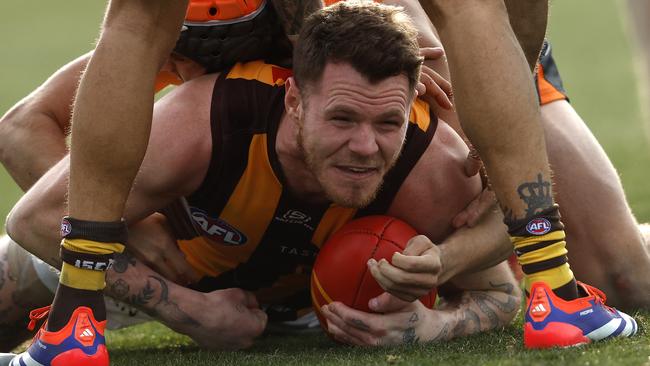 Hawthorn's Blake Hardwick tackled by Giants Darcy Jones during the AFL Round 21 match between the GWS Giants and Hawthorn Hawks at Manuka Oval, Canberra on August 4, 2024. Photo by Phil Hillyard(Image Supplied for Editorial Use only - **NO ON SALES** - Â©Phil Hillyard )