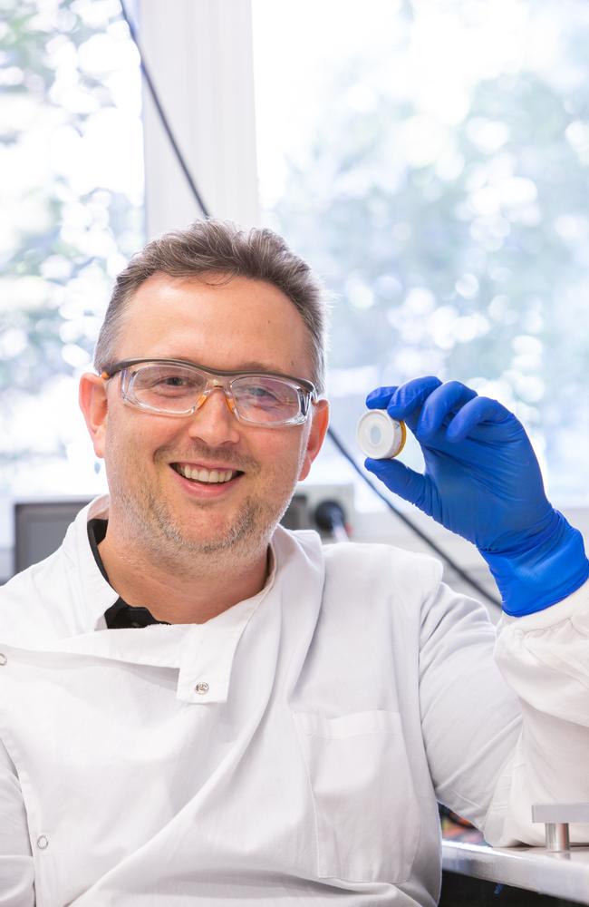 Dr David Muller of UQ with the vaccine patch that could deliver a Covid-19 vaccine.