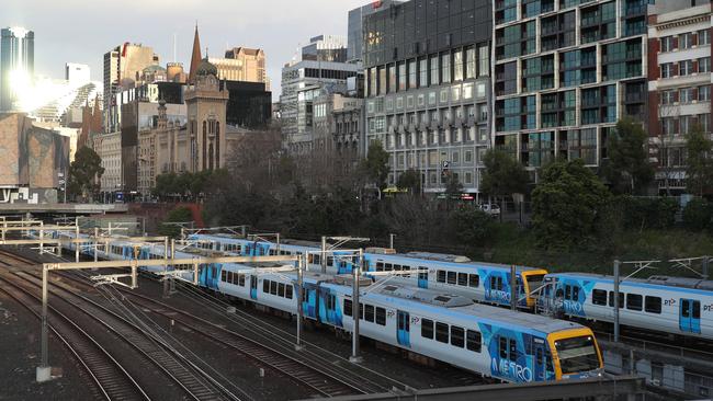 Trains arrive at Flinders street station. Picture: NCA NewsWire / David Crosling